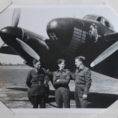 Three airmen in front of a Mosquito